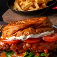 Buffalo Chicken Sandwich · Delicious sandwich made with Buffalo Chicken. Topped with lettuce, tomatoes, cheddar cheese,...