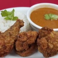 Pollo Frito · Fried Chicken
with tostones, rice and beans or moro