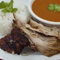 Pernil  · leg 
with tostones, rice and beans or moro