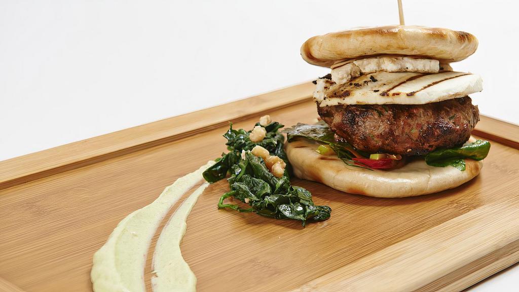 Grass-Fed Greek Burger · Prime Chuck Sirloin burger with Greek Feta Cheese, onions, lettuce and tomato. Served on a brioche bun.