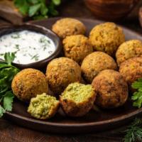 Falafel · Six pieces of spiced chickpea balls with hummus, tomato, lettuce and onion.