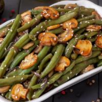 String Beans · Satisfying string beans are sautéed in extra virgin olive oil & garlic.