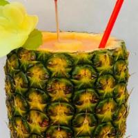 Smoothie In A Freshly-Cored Hawaiian Pineapple · Fresh smoothie in a cored pineapple. All smoothies are non-dairy and made with coconut water...