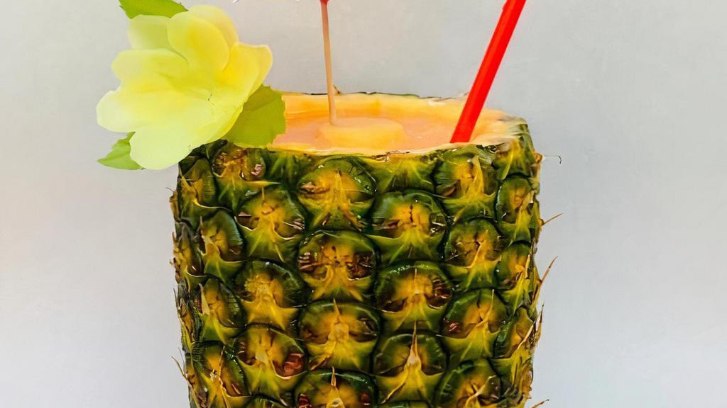 Smoothie In A Freshly-Cored Hawaiian Pineapple · Fresh smoothie in a cored pineapple. All smoothies are non-dairy and made with coconut water. Serves approximately 16 ounces.