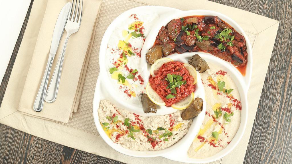Mixed Cold Appetizers · Hummus, Baba Ghanoush, Labne, Eggplant salad, Ezme, and Grape leaves
Served with 2  Whole Pita bread