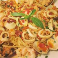 Zuppa Di Pesce Over Linguine · Sautéed Shrimp, calamari, mussels, and clams in your choice of sauce over linguine.
