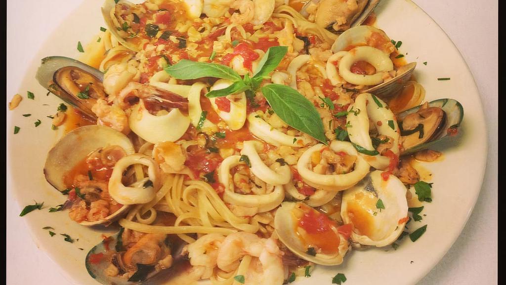 Zuppa Di Pesce Over Linguine · Sautéed Shrimp, calamari, mussels, and clams in your choice of sauce over linguine.
