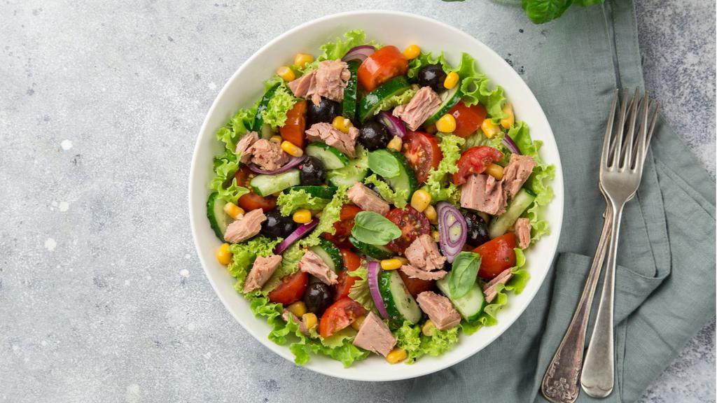 Healthy Tuna Salad · Tuna Salad mixed with Romaine lettuce, fresh avocado, chickpeas, carrots, and Italian dressing.
