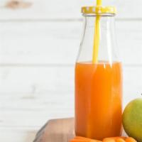 Detox Power Juice · Detoxing juice of carrots, green apple, lemon, and ginger.