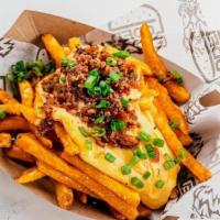 (Sm) Classic Loded Fries · Crispy Fries topped with house cheese sauce and chopped bacon.
