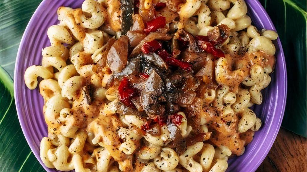 Vegan Pesto Mac · LODED’s Plant based MAC N Cheegan topped with grilled onions & peppers, fire roasted red pepper pesto mayo, & hummus