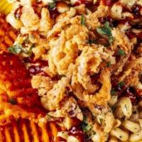 Vegan Southwest Bbq Mac · LODED’s Plant based MAC N Cheegan topped with Sweet potato waffle fries, frizzled onions , s...