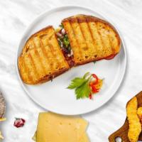 Blt Triad Panini · Crispy bacon, lettuce, tomato, and mayo on toasted bread.