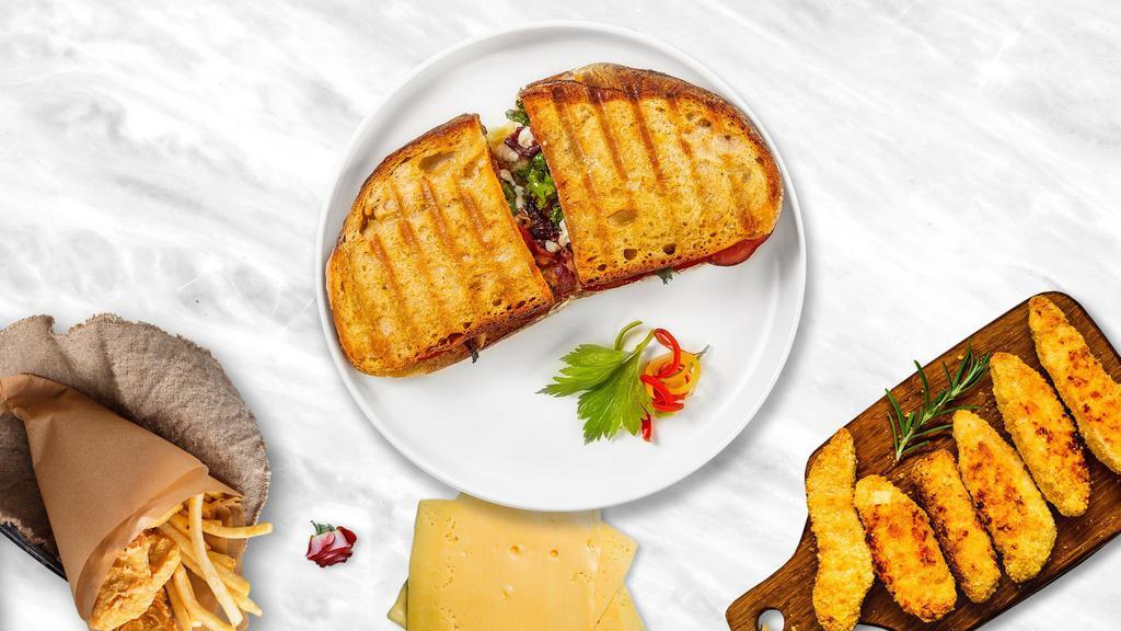 Blt Triad Panini · Crispy bacon, lettuce, tomato, and mayo on toasted bread.