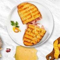 Turkey Trouble Panini · Turkey breast, Swiss cheese, tomato, and mayo on toasted bread.