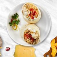 Cluck Chuck Burrito · Grilled chicken topped with sour cream, salsa, cheese, and spanish rice wrapped in a warm to...