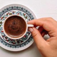 Turkish Coffee - Double · Turkish coffee prepared traditionally in a sandpit, served with the grounds in the cup