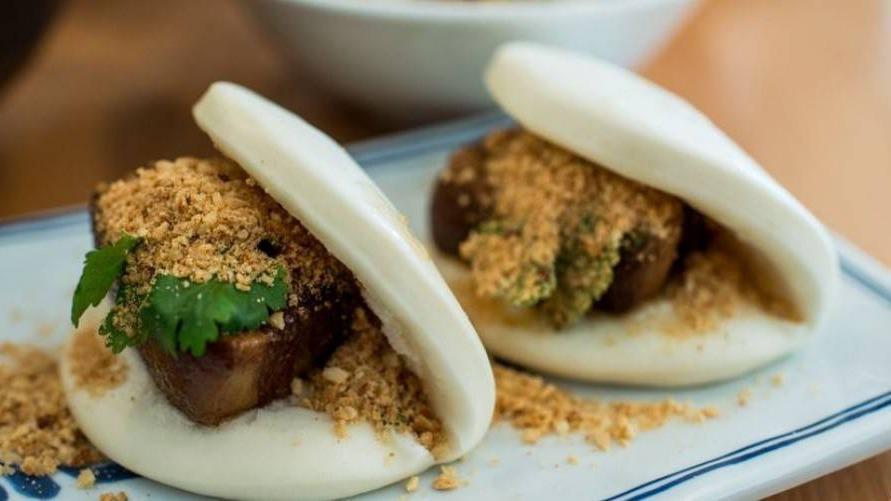 Gua Bao (2 Pcs.) · Stewed pork belly sandwiched with cilantro, and peanut powder.