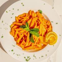 Penne Alla Vodka · Penne pasta tossed in vodka tomato sauce and basil.