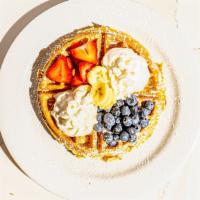Tropical Waffle · Strawberries, bananas, blueberries, whipped cream & raisins.