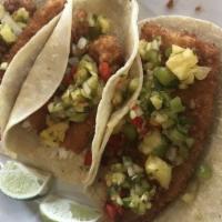 Fish Tacos  · Pineapple salsa, cilantro, and time.