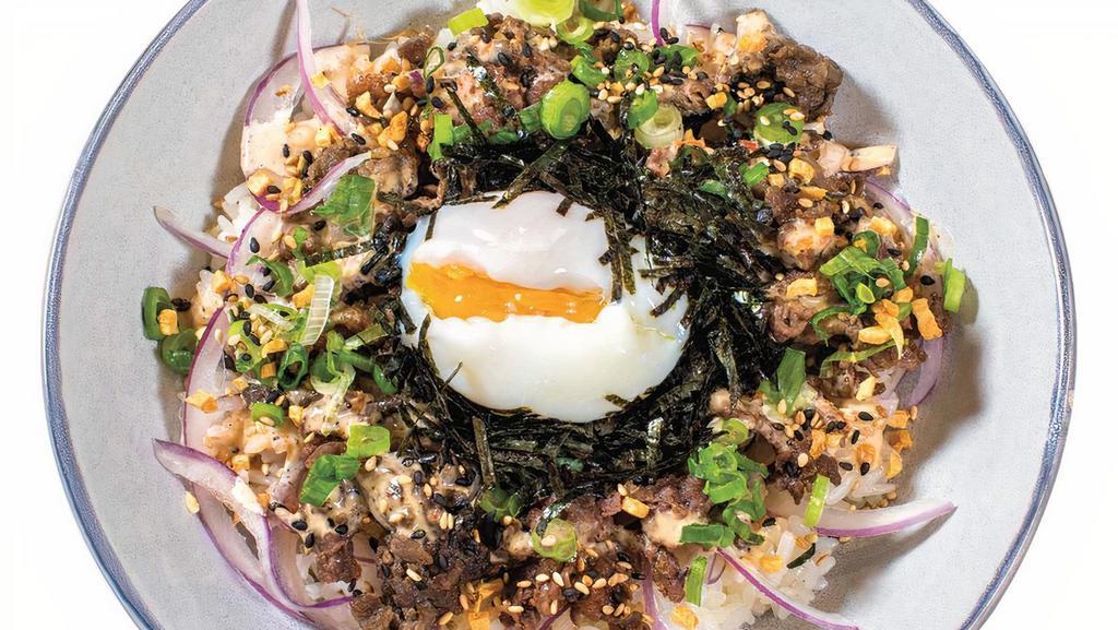 Seoul 불고기 · Grilled Bulgogi beef rib eye, red onion, savory sesame aioli, scallion, ORGANIC POACHED EGG, toasted seaweed, crunchy garlic, sesame seeds