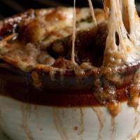 French Onion Soup · Croutons and caramelized Gruyere cheese.