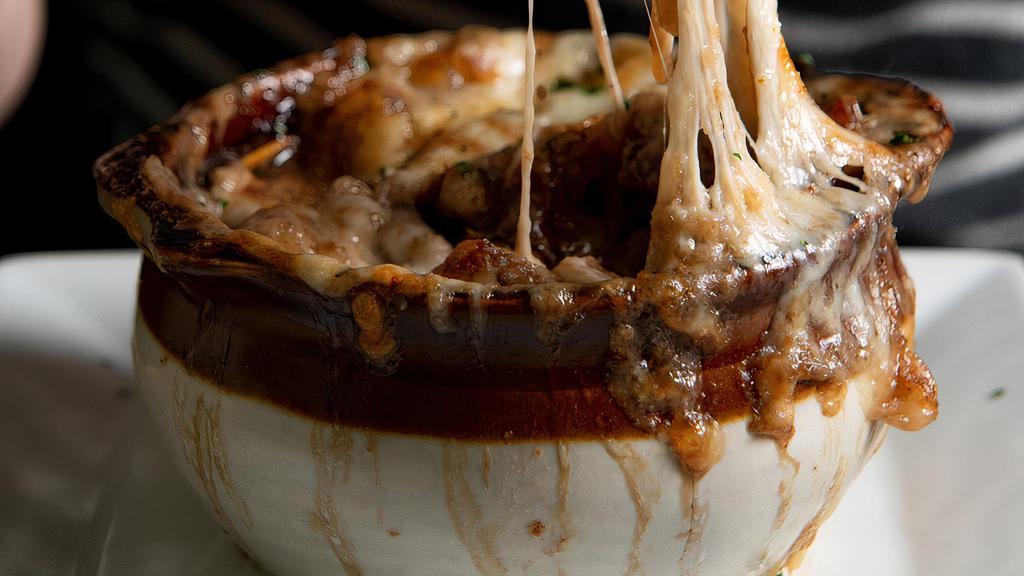 French Onion Soup · Croutons and caramelized Gruyere cheese.