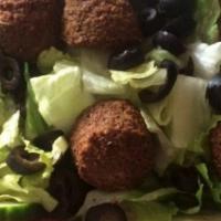 Falafel Salad · Five pieces of falafel, tahini, mix green, tomato, onions, Persian pickled cucumbers.