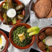 Mezza Royal · Hummus, labneh, falafel, baba ghannouj, taboulah, grape leaves.