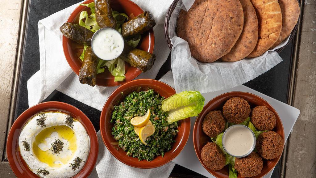 Mezza Royal · Hummus, labneh, falafel, baba ghannouj, taboulah, grape leaves.