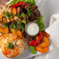Mixed Grill · Kabob combination platter of chicken and lamb kabob, kofta, and lamp chops served with grill...