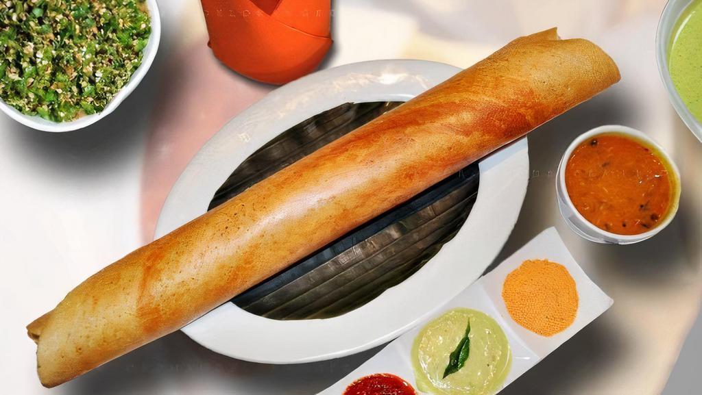 Masala Dosa Or Mysore Dosa · From the Coromandel coast. A paper-thin rice and lentil crepe stuffed with spiced potatoes and peas, served with coconut chutney and sambar. (Appetizer for two).
