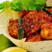 Chili Paneer · Medium spicy, contains gluten. Batter fried homemade cheese cubes  tossed with onions, peppe...