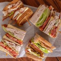 Turkey Club · Triple decker with bacon, lettuce, and tomato.