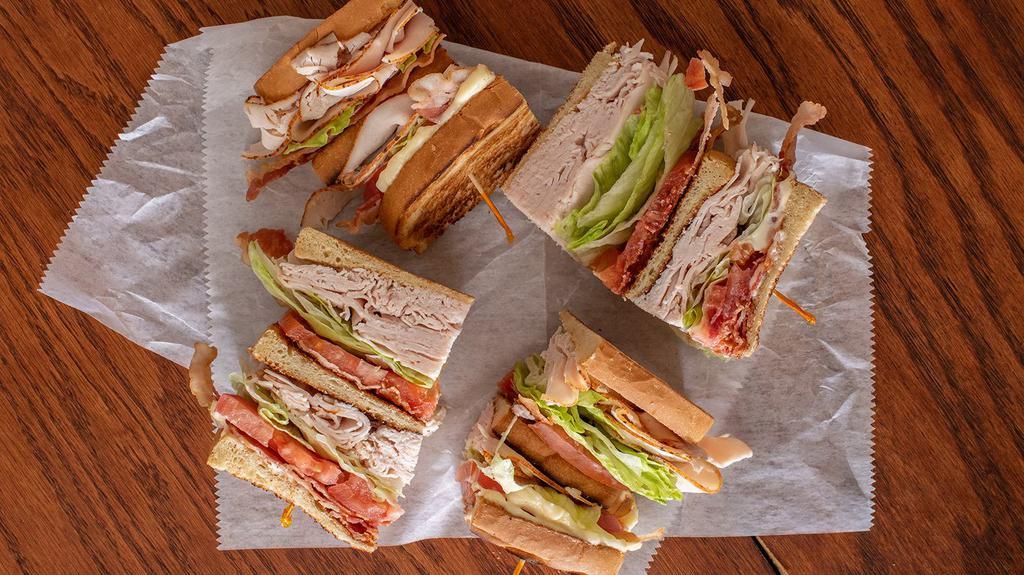 Turkey Club · Triple decker with bacon, lettuce, and tomato.