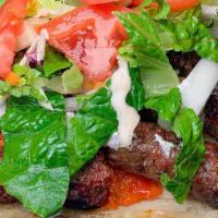 Cevapi  10Pcs · Ground beef and lamb kebabs sandwich. Lettuce, tomato, onions, sour cream and ayvar. Vegetab...