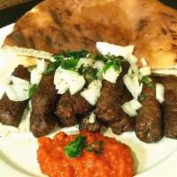 Cevapi  5Pcs · Ground beef and lamb kebabs. With Lettuce, tomato, onions, sour cream, and ayvar. Vegetable ...