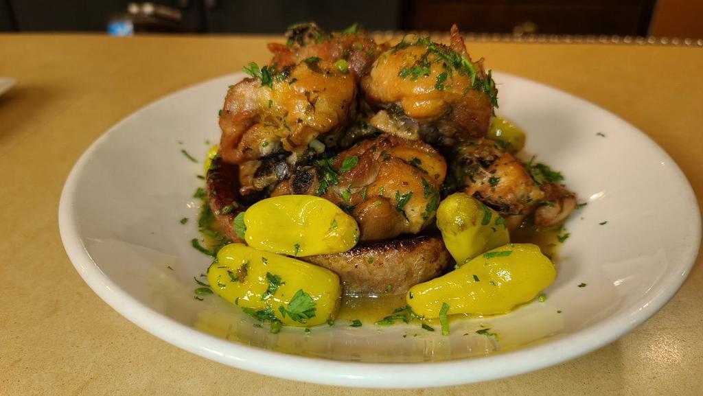 Papa G'S Chicken Scarpariello · Bone in dark meat chicken pieces with sweet or hot sausage and pepperoncini’s.