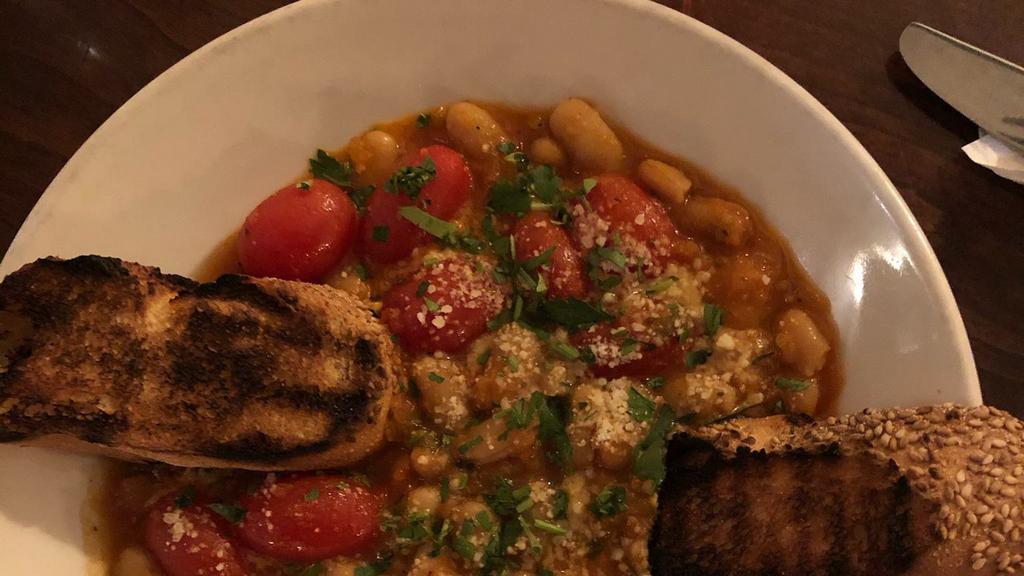 White Bean Ragout · White beans, garlic, tomato, and rosemary comes with grilled bread.