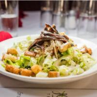 Caesar Salad · Romaine, anchovies, Parmesan, and croutons.
