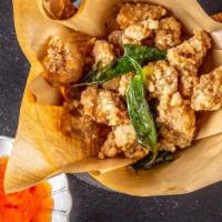 Crispy Popcorn Chicken 香酥鸡米花 · Rice flour coated chicken thigh fried with basil and kaffir lime leave