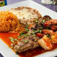 Steak Con Camarones · Shell steak served with shrimp and tampiquena sauce.