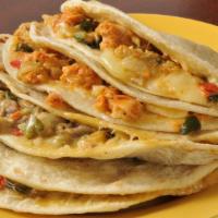 Chicken Steak Combo Quesadilla · Flour tortilla filled with chicken, steak, cheddar and jack cheeses. Serve with salsa and so...