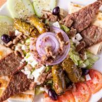 Greek Salad · Feta cheese, lettuce, tomato, anchovies, cucumbers, olives, scallion and stuffed grape leave...