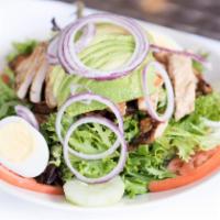 Cobb Salad · Sliced grilled chicken breast, avocado, bacon, tomatoes, cucumbers, red onion and a hard boi...