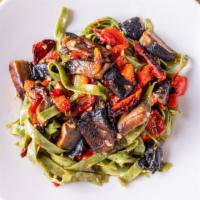 Spinach Pasta · In olive oil and garlic, tossed with portobello mushrooms, sun-dried tomatoes and roasted pe...