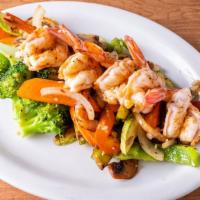 Cajun Shrimp · Grilled baby shrimp, marinated with Cajun spices, serve over sauteed mixed vegetables.