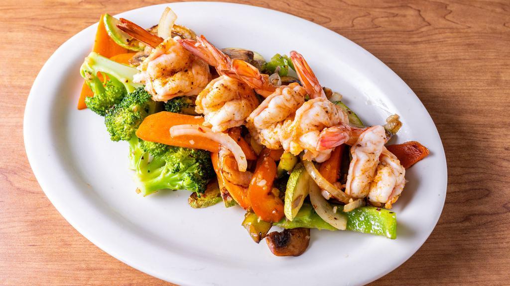 Cajun Shrimp · Grilled baby shrimp, marinated with Cajun spices, serve over sauteed mixed vegetables.