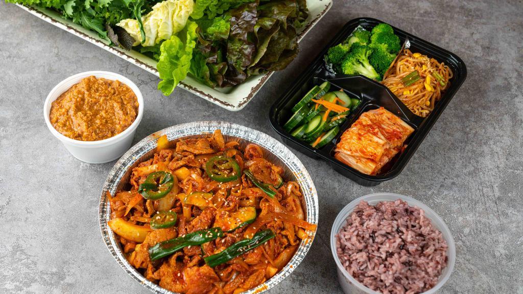 Ssambap Jeonsik For 2 People · Stir-fried spicy pork with fresh vegetable and two rice and 16 oz soybean stew and side dishes.